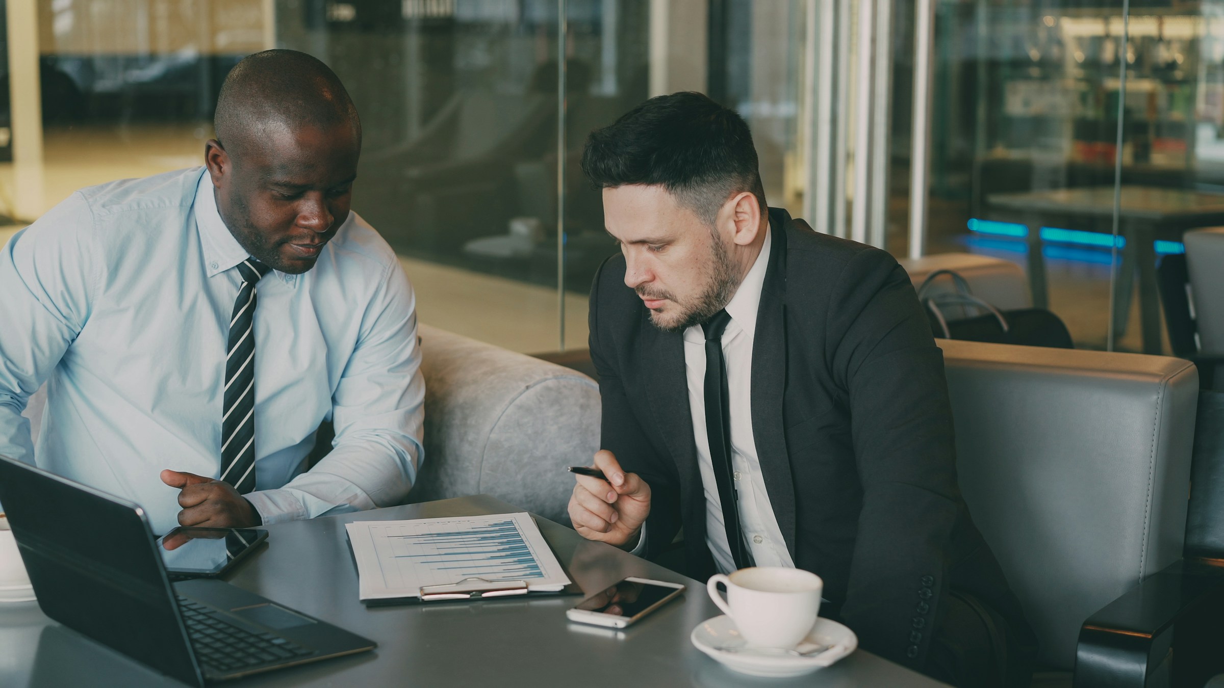 Insurance agent discussing business protection and insurance solutions with a small business owner